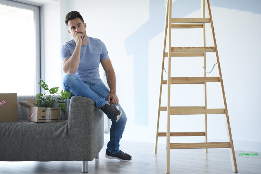 young man making plans his new flat 2